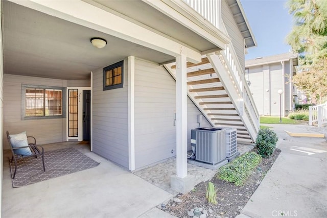 entrance to property with a patio and central AC