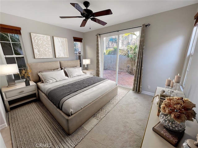 carpeted bedroom featuring ceiling fan and access to outside