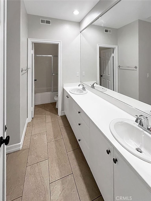 full bathroom featuring tile patterned flooring, vanity,  shower combination, and toilet