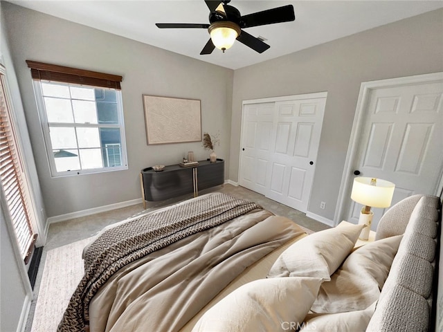 bedroom with carpet floors, a closet, and ceiling fan