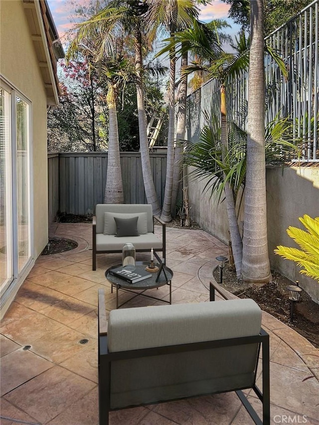 view of patio terrace at dusk