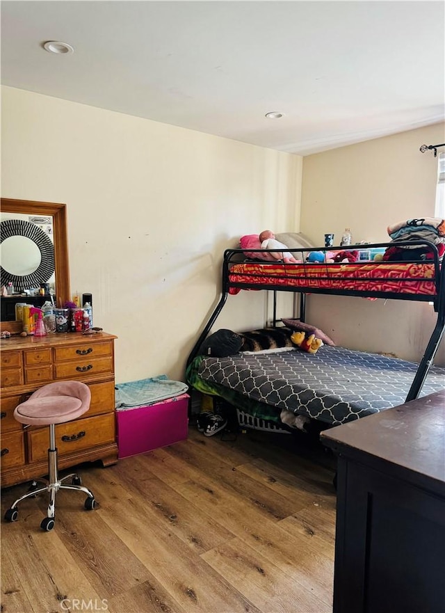 bedroom with light hardwood / wood-style floors