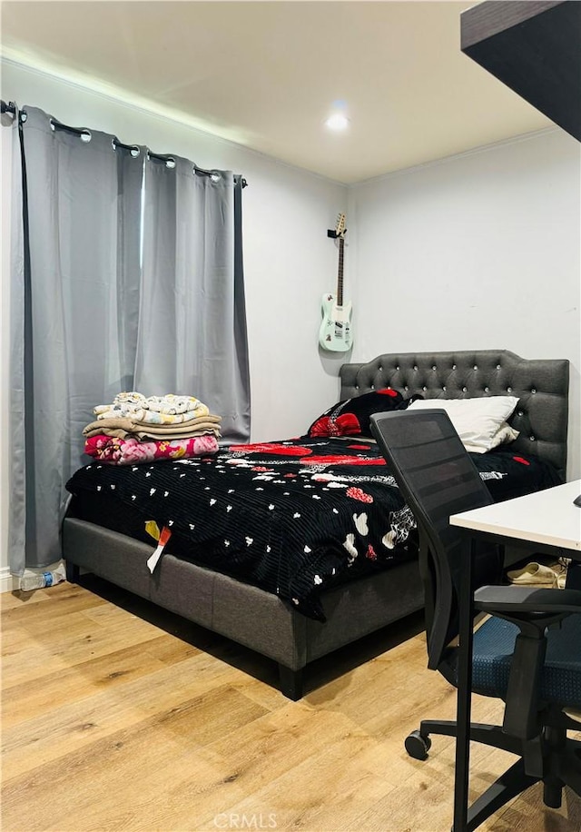 bedroom with wood-type flooring