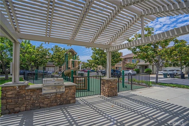 view of patio featuring a pergola, area for grilling, and a playground