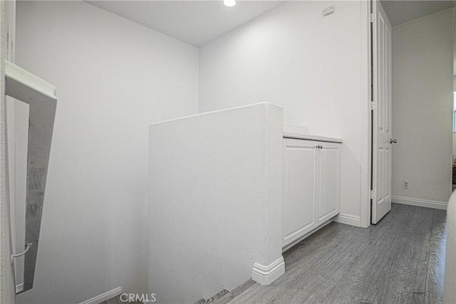 hallway featuring hardwood / wood-style flooring