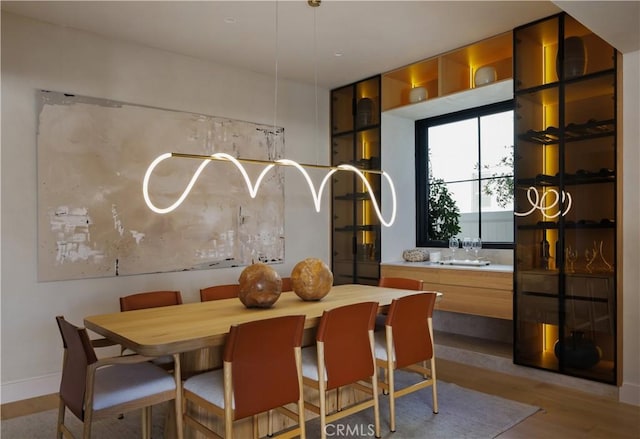 dining space with light hardwood / wood-style flooring