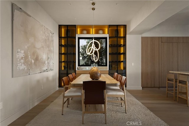 dining area featuring built in features and light hardwood / wood-style flooring