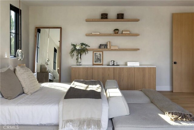 bedroom featuring wood-type flooring