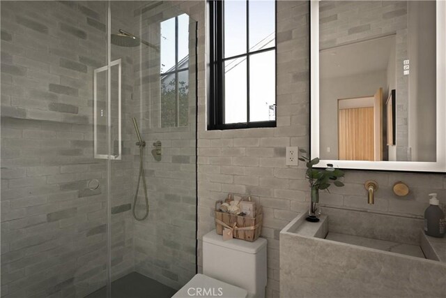 bathroom featuring walk in shower and toilet