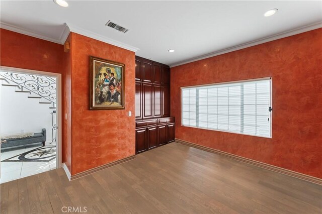 bar with crown molding and hardwood / wood-style flooring