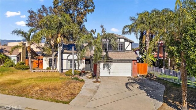 view of front of property with a front lawn and a garage