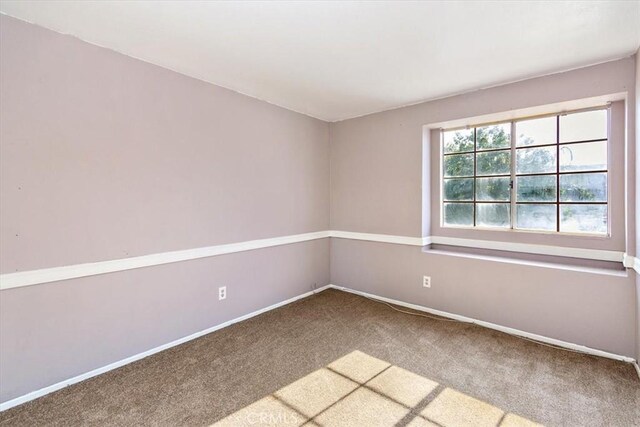 view of carpeted spare room