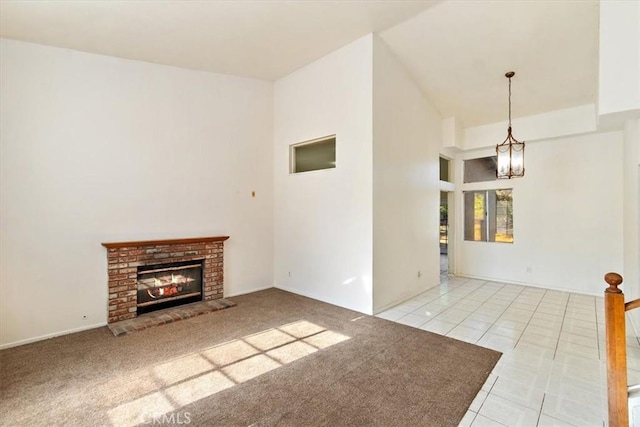 1520 W Norwood St, Rialto, CA 92377 - unfurnished living room featuring tile patterned flooring, a chandelier, and a fireplace