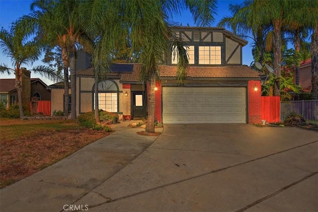 view of front of home featuring a garage and solar panels