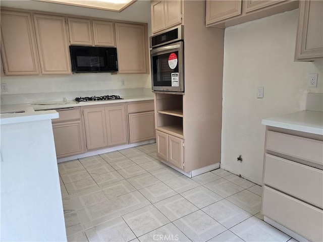 1520 W Norwood St, Rialto, CA 92377 - kitchen with light tile patterned floors, baseboards, appliances with stainless steel finishes, and light countertops
