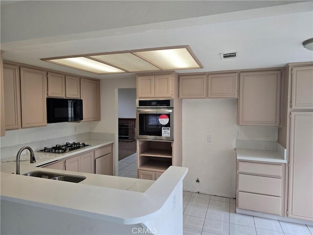 1520 W Norwood St, Rialto, CA 92377 - kitchen with a sink, visible vents, appliances with stainless steel finishes, light countertops, and light tile patterned floors