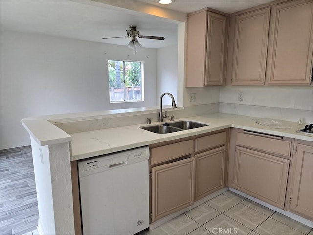 1520 W Norwood St, Rialto, CA 92377 - kitchen with a sink, dishwasher, ceiling fan, a peninsula, and light stone countertops