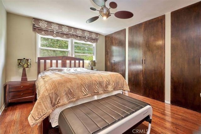 bedroom featuring ceiling fan and wood-type flooring