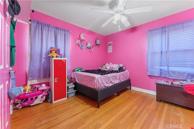 bedroom featuring hardwood / wood-style floors and ceiling fan