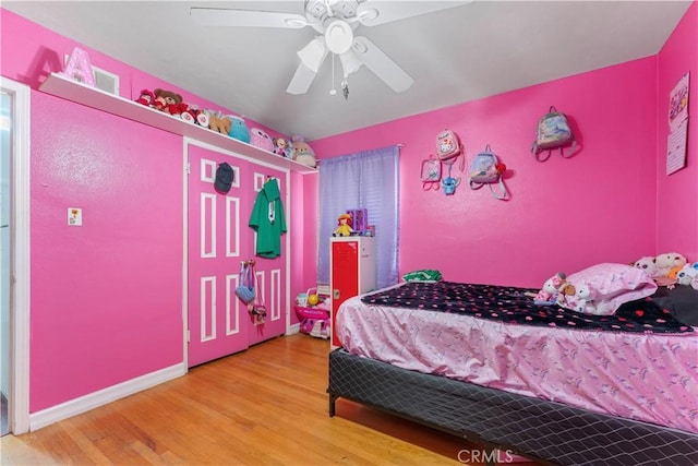 bedroom with ceiling fan and hardwood / wood-style floors