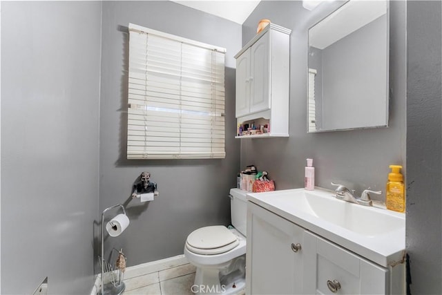 bathroom with tile patterned floors, vanity, and toilet