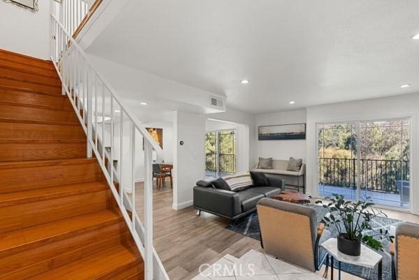 living room with light hardwood / wood-style floors