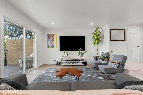 living room with light hardwood / wood-style flooring