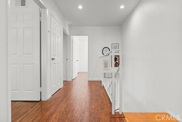 hallway featuring dark hardwood / wood-style floors