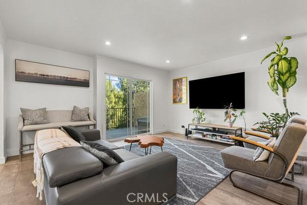 living room with light hardwood / wood-style flooring