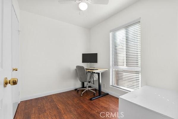 home office featuring ceiling fan and dark hardwood / wood-style floors