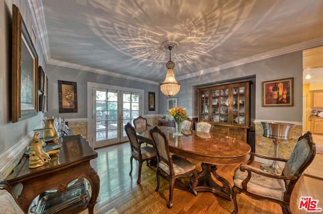 dining room with french doors, hardwood / wood-style flooring, and crown molding