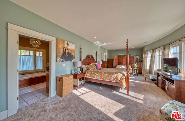 bedroom with multiple windows and light carpet