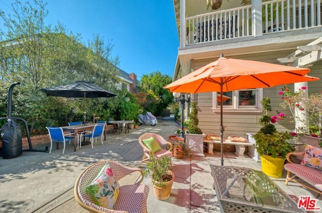 view of patio with a balcony