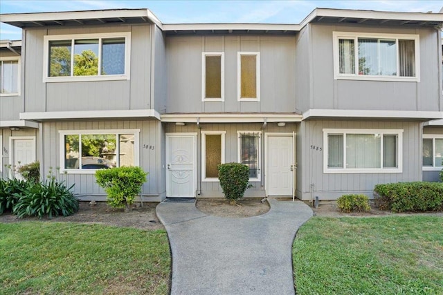 view of property with a front lawn