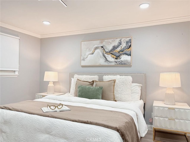 bedroom featuring ornamental molding, recessed lighting, and wood finished floors