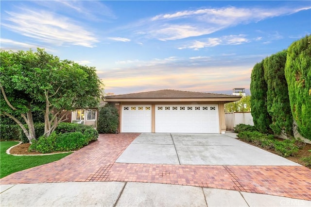 view of front of property with a garage