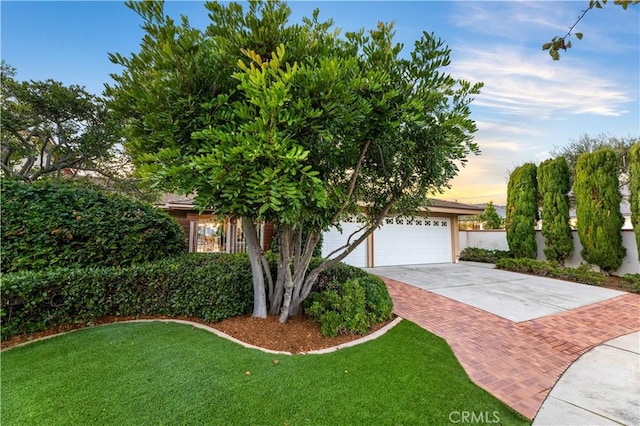 obstructed view of property featuring a yard