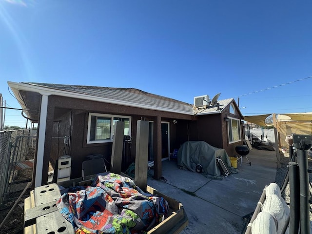 back of property with central air condition unit