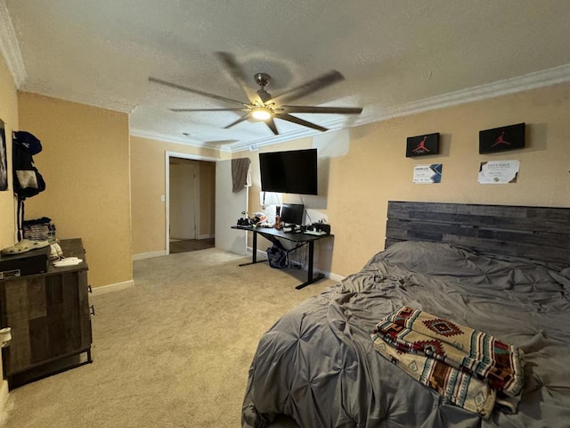 carpeted bedroom featuring a textured ceiling, ceiling fan, and ornamental molding