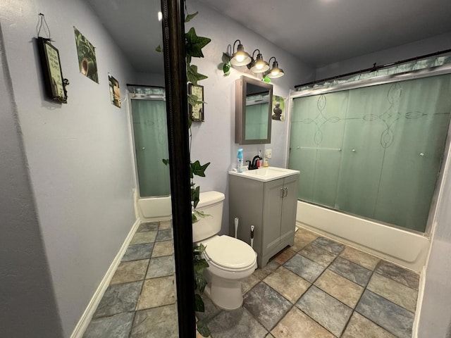 full bathroom featuring shower / bath combination with glass door, vanity, and toilet