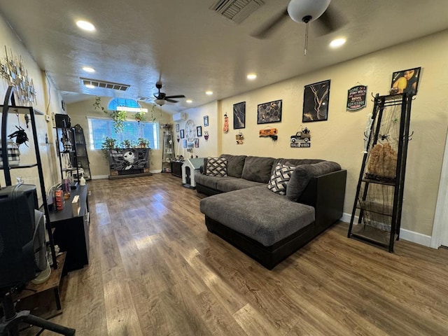 living room with hardwood / wood-style flooring and ceiling fan