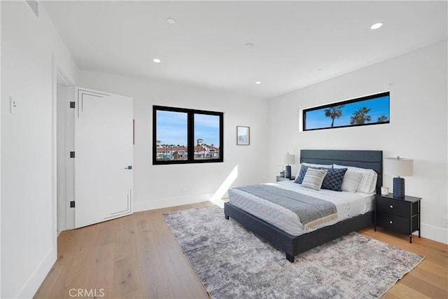 bedroom with light wood-type flooring