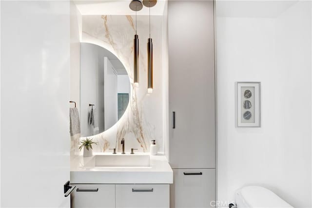 bathroom featuring toilet and vanity