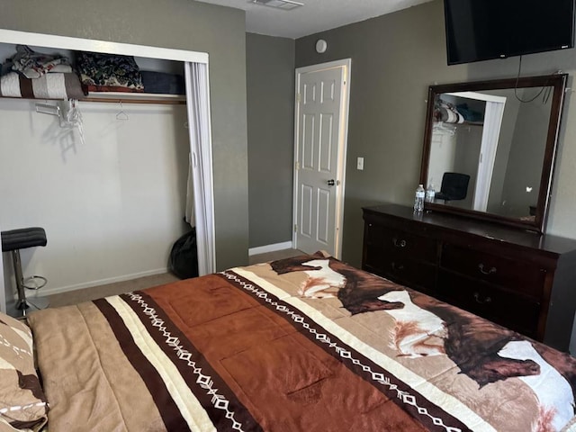 bedroom featuring a closet and carpet flooring