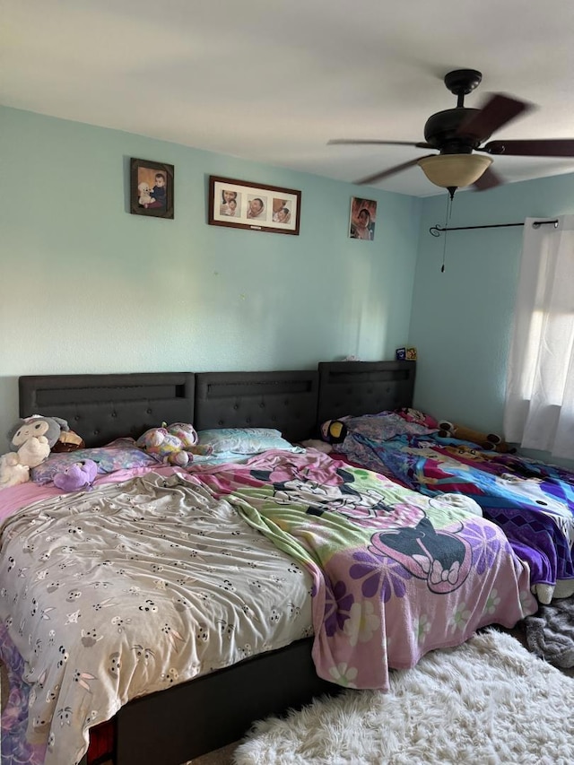 bedroom featuring carpet floors and ceiling fan