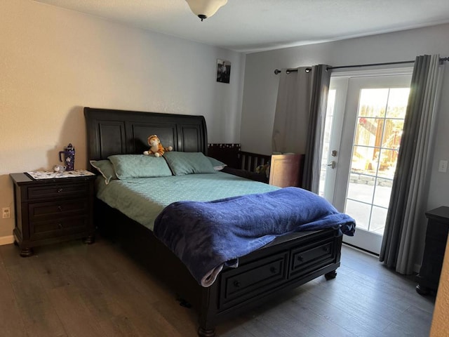 bedroom featuring access to outside, multiple windows, and light hardwood / wood-style flooring