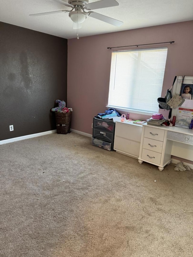 interior space with ceiling fan and light colored carpet