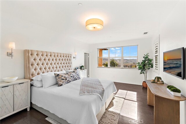 bedroom featuring dark hardwood / wood-style floors