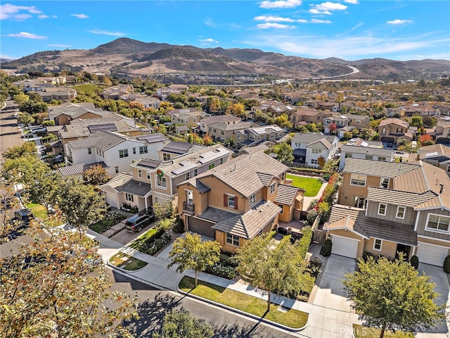 birds eye view of property with a mountain view