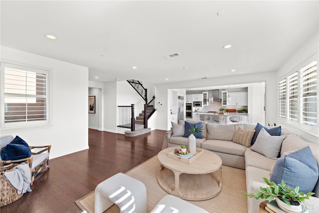 living room featuring hardwood / wood-style flooring and a wealth of natural light